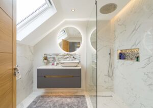 LED backlit mirror and small vanity unit in Kingston bathroom renovation.