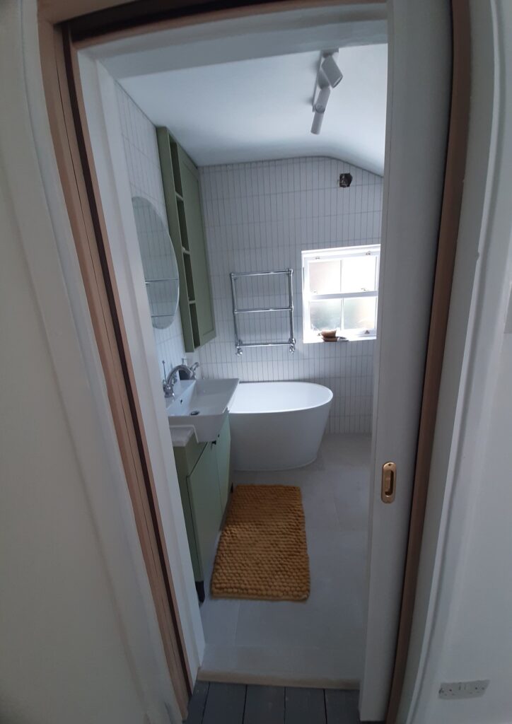 Pocket door in bathroom renovation Kingston upon Thames.