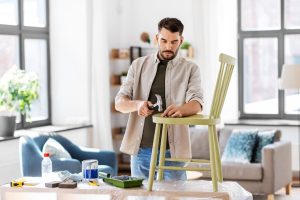 Professional painters and decorators Wimbledon transforming a modern living room with premium interior painting.