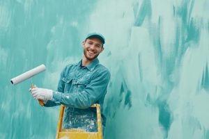 Professional painters and decorators working on walls and ceilings